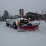 snow plow removing snow on the road