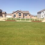 backyard landscape design with green grass