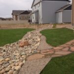 landscape design with walkway and rocks